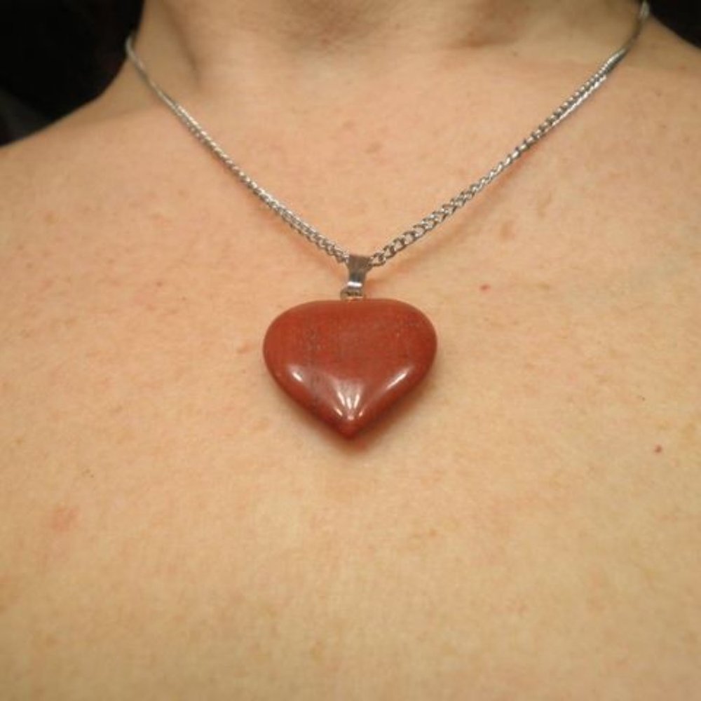 Semi-Precious Red-Heart Stone. On a silver chain. Almost 10 in. long.
